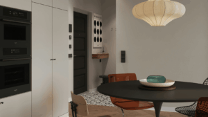 Esszimmer im skandinavischen Stil, links sieht man eine Küchenzeile, rechts einen runden Esstisch mit Stühlen