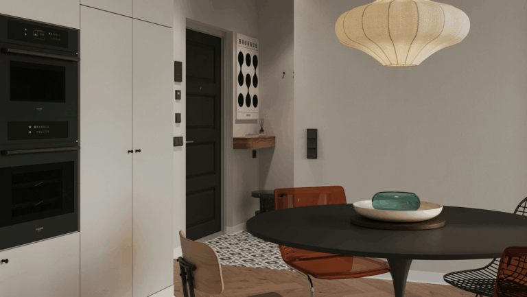 Esszimmer im skandinavischen Stil, links sieht man eine Küchenzeile, rechts einen runden Esstisch mit Stühlen